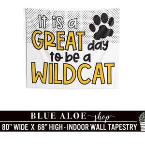 May include: White tapestry with black polka dots and a black paw print. It reads "It is a GREAT day to be a WILDCAT". The tapestry is 80 inches wide and 68 inches high.