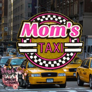 May include: A sign that reads "Mom's TAXI" in pink and gold, with a black and white checkered border. The sign is in front of yellow taxi cabs on a city street. The Black Cat Tumblers and Scents logo is in the lower left corner.
