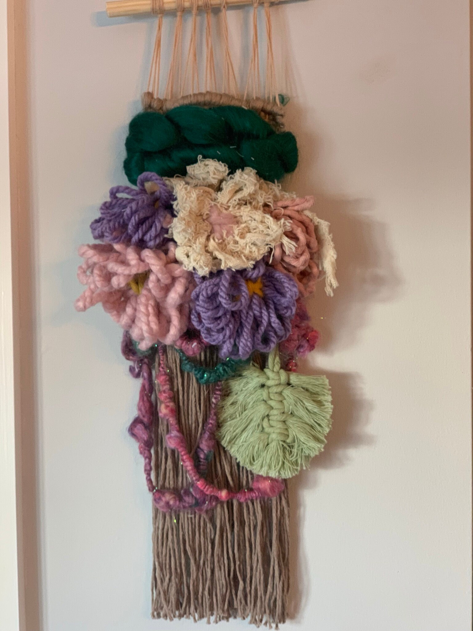 A closer look at Textured Fabric Wall Hanging With Woven Flowers