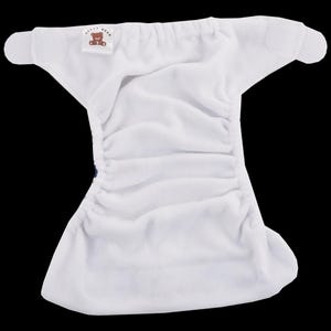 May include: White cloth nappy with a velcro fastening and a small label that says "Happy Bear".