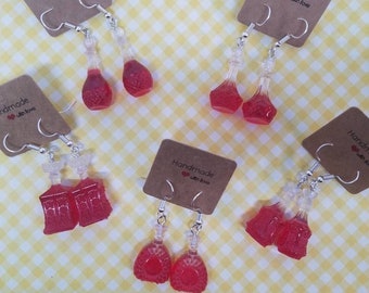 Pair of earrings in the shape of miniature resin wine/blood carafes for Halloween