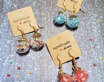 Rhinestone earrings in glass ball