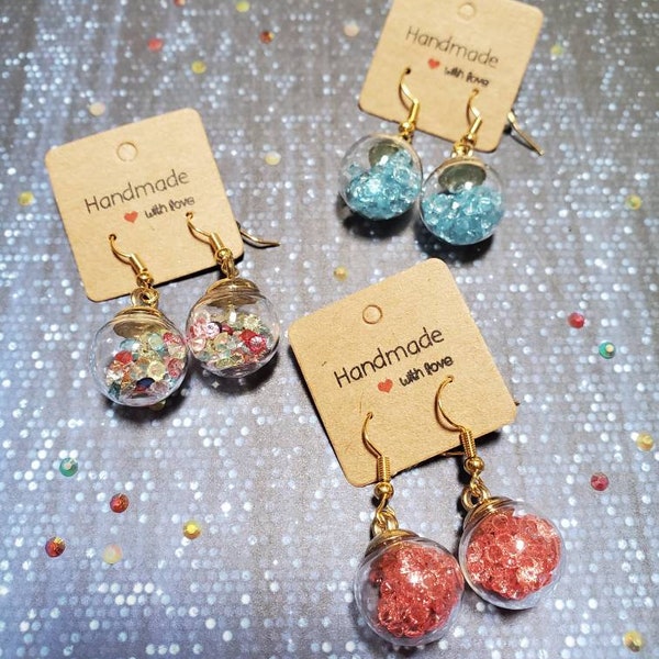 Boucles d'oreilles strass dans boule en verre