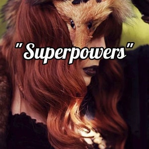 May include: A woman with long, red hair wears a fox fur hat. The text "Superpowers" is written in white letters on a black background.