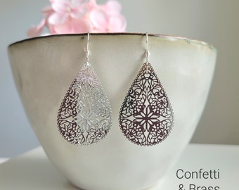 Silver earrings with filigree teardrop-shaped ornament and stainless steel ear hooks