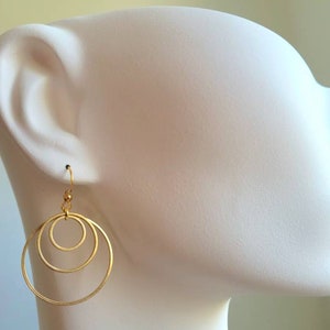 Earrings with 3 golden stainless steel rings and stainless steel ear hooks image 8