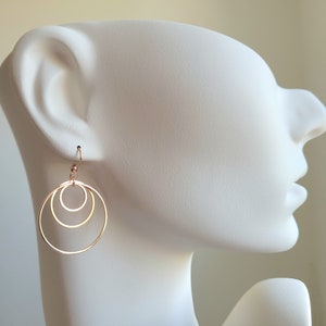 Earrings with 3 golden stainless steel rings and stainless steel ear hooks image 4