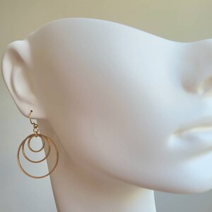 Earrings with 3 golden stainless steel rings and stainless steel ear hooks image 6