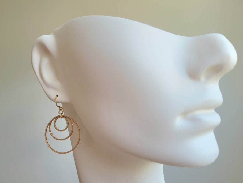Earrings with 3 golden stainless steel rings and stainless steel ear hooks image 6
