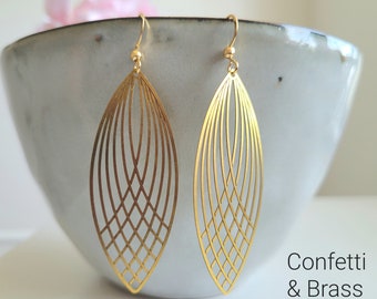Long earrings with delicate brass pendants and stainless steel ear hooks