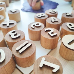 Wooden numbers and math symbols play dough stamps. Montessori-inspired learning material for toddlers and preschoolers. image 4