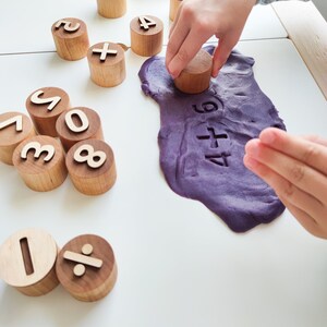 Wooden numbers and math symbols play dough stamps. Montessori-inspired learning material for toddlers and preschoolers. image 6