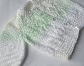 Hand knitted baby cardigan in white and pale green soft wool. Cute design.