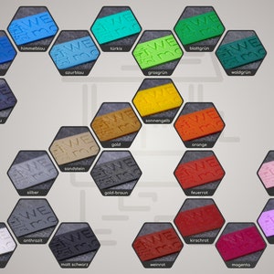 May include: A chart of 20 color swatches in a hexagonal shape. Each swatch has the word "WE" and the number "30" embossed on it. The swatches are arranged in a honeycomb pattern. The colors include indigo, azurblou, t&uuml;rkis, grasgr&uuml;n, blattgr&uuml;n, nachtblou, sonnengelb, sandstein, gold, gold-braun, orange, feuerrot, kirschrot, waldgr&uuml;n, flamingo, flieder, magenta, kolkwei&szlig;, anthrazit, and matt schwarz.
