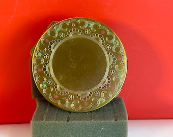 Estuche compacto grande vintage color dorado con puntos de colores.