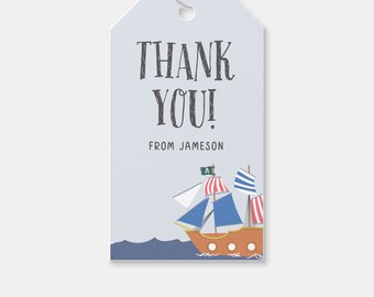 May include: A blue and white thank you gift tag with a pirate ship illustration and the text "Thank You! From Jameson".