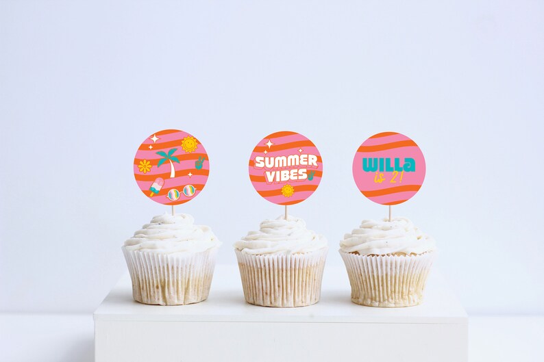 May include: Three cupcakes with pink and orange striped cupcake toppers. The toppers have different designs, one with a palm tree and sunglasses, one with the text "Summer Vibes", and one with the text "Willa is 21".