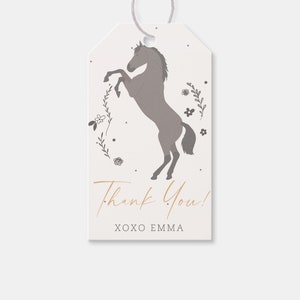 May include: A white thank you tag with a gray horse silhouette and floral accents. The text "Thank You! XOXO EMMA" is printed in gold.