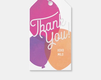 May include: Thank You gift tag with a watercolor design of three balloons in pink, purple, and orange. The text "Thank You!" is written in white cursive font. The tag also includes the text "XOXO MILO" in a smaller font.