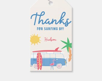 May include: A blue and white vintage van with a surfboard on the roof. The van has a pink flamingo beside it. The text "Thanks for surfing by!" is written in blue. The name "Hudson" is written in red. The image is a thank you tag for a party.