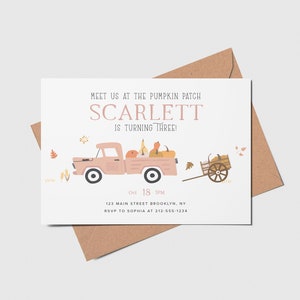 May include: A pink and white invitation card with a cartoon illustration of a pink truck carrying pumpkins. The text on the card reads "Meet us at the pumpkin patch Scarlett is turning three! Oct 18 3PM 123 Main Street Brooklyn, NY RSVP to Sophia at 212-555-1234"