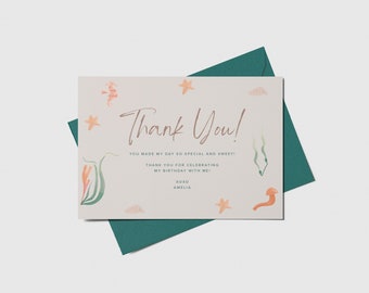 May include: A thank you card with a watercolor illustration of sea life, including starfish, seahorses, and seaweed. The card reads "Thank You! You made my day so special and sweet! Thank you for celebrating my birthday with me! xoxo Amelia"