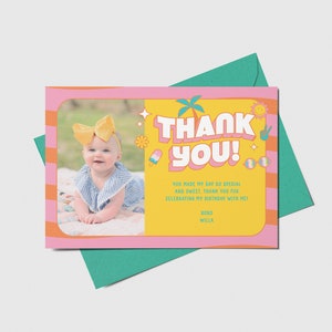 May include: A pink and yellow thank you card with a photo of a baby girl wearing a yellow bow and a blue and white striped dress. The text on the card reads "Thank You! You made my day so special and sweet. Thank you for celebrating my birthday with me! Koko Willa."