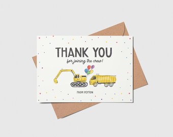 May include: A white thank you card with colorful confetti. The card says "Thank you for joining the crew!" with a yellow excavator and dump truck illustration. The card is signed "From Peyton".