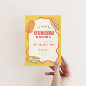 May include: A yellow and red birthday party invitation with a hot dog theme. The invitation says "Hot Diggity Dog Hudson is turning 8!" and includes the date and time of the party.