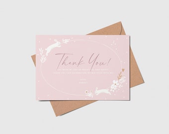 May include: Pink thank you card with a white oval frame and white bunnies with floral accents. The text reads "Thank You! You made my day so special and sweet. Thank you for celebrating my birthday with me!" with the name "Ruby" below.