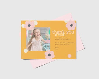 May include: A yellow thank you card with a photo of a girl smiling. The card has pink and white flowers and the text "thank you so much" with a message thanking guests for celebrating the birthday.