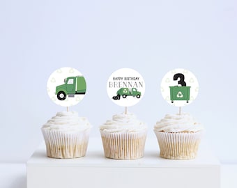 May include: Three green and white cupcake toppers with a garbage truck, a garbage truck with the text "Happy Birthday Brennan" and a garbage can with the number 3 on it.