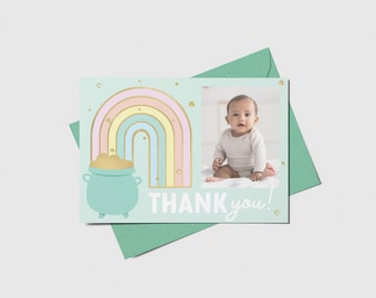 May include: A light blue thank you card with a rainbow and a pot of gold. A photo of a baby is in the corner of the card.