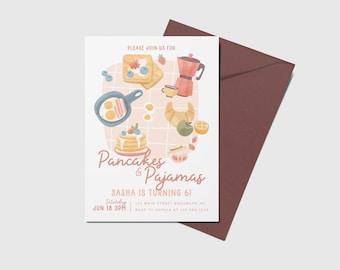 May include: A pink and white invitation card with a watercolor illustration of breakfast foods, including pancakes, toast, eggs, and a croissant. The text on the card reads "Please join us for Pancakes & Pajamas Sasha is turning 61 Saturday Jun 18 3PM 123 Main Street Brooklyn, NY RSVP to Sophia at 212-555-1234"