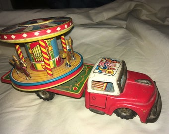rare antique TN NOMURA Tin toy , Tin Litho Clown Circus Truck with carousel working friction drive