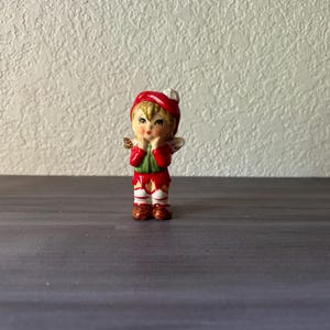 Vintage Ceramic Pixie Elf Figurine, Vintage Japan Vagabond Angel, Wears a Tam Hat, Red Coat, Green Scraf and Candy Cane Striped Socks