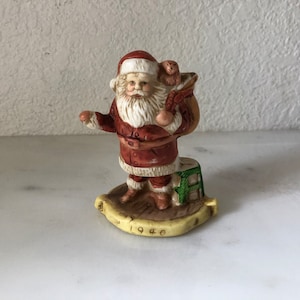 Vintage 1940 Santa Through Years Hand Painted Porcelain Figurine