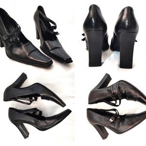 May include: Four pairs of black leather heeled shoes with ankle straps and buckles. The shoes have a pointed toe and a chunky heel.