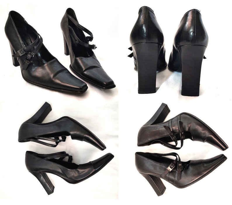 May include: Four pairs of black leather heeled shoes with ankle straps and buckles. The shoes have a pointed toe and a chunky heel.