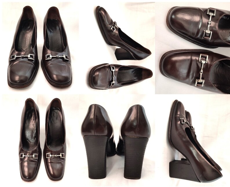May include: A pair of brown leather heeled shoes with a silver buckle detail. The shoes have a square toe and a chunky heel.