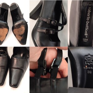May include: Black leather heeled shoes with a buckle strap and a pointed toe. The shoes have a label that reads "roberto botticelli" and "made in italy".