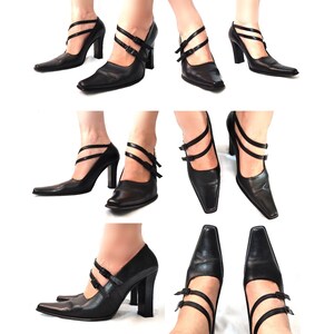 May include: Black leather pumps with a pointed toe and a high heel. The shoes have a double strap design with buckles.