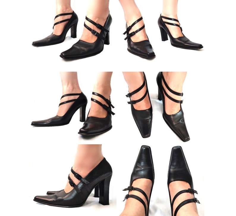 May include: Black leather pumps with a pointed toe and a high heel. The shoes have a double strap design with buckles.