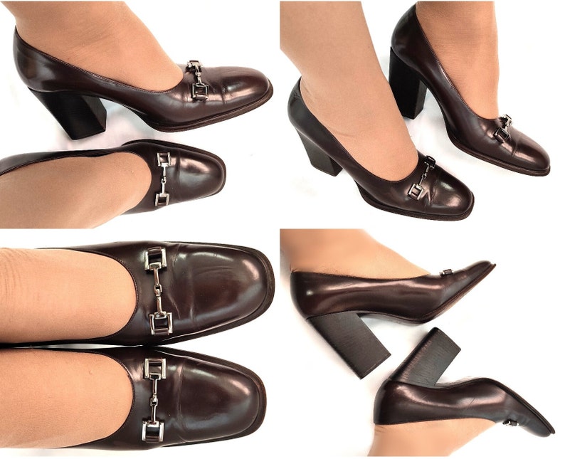 May include: Brown leather pumps with a chunky heel and a silver buckle detail. The shoes have a square toe and are shown on a white background.