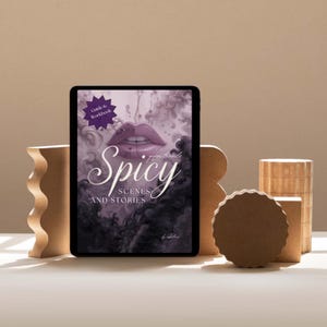 Interactive PDF guide for writing spicy and intimate scenes in romance and erotica, including six chapters, creative writing exercises, tips for pacing, sensory detail, consent, and story integration, with full-color and grayscale versions for printing.