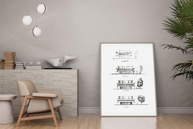 May include: A black and white architectural drawing of a house with different stages of design, labeled "Concept", "Solution", "First Draft", and "Final". The drawing is framed and hanging on a white wall in a modern living room.