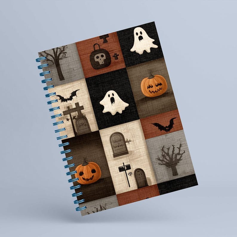 May include: A spiral-bound notebook with a Halloween design. The cover has a patchwork pattern with spooky illustrations, including pumpkins, ghosts, bats, and tombstones. The colour palette includes orange, black, and grey.