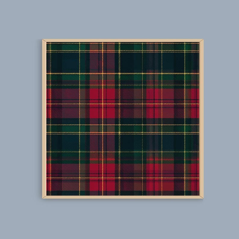 May include: A framed print featuring a tartan pattern in shades of red, green, yellow, and navy blue. The plaid design has a traditional woven appearance, with intersecting lines creating a grid-like structure. The frame is a light beige color.