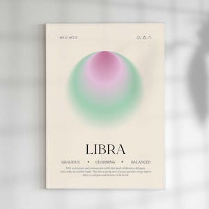 May include: A framed art print featuring the Libra zodiac sign. The design includes a gradient circle in pink and green hues, the word "LIBRA" in a bold font, and the dates "SEP. 23 - OCT. 22". The print also lists the traits "GRACIOUS", "CHARMING", and "BALANCED".