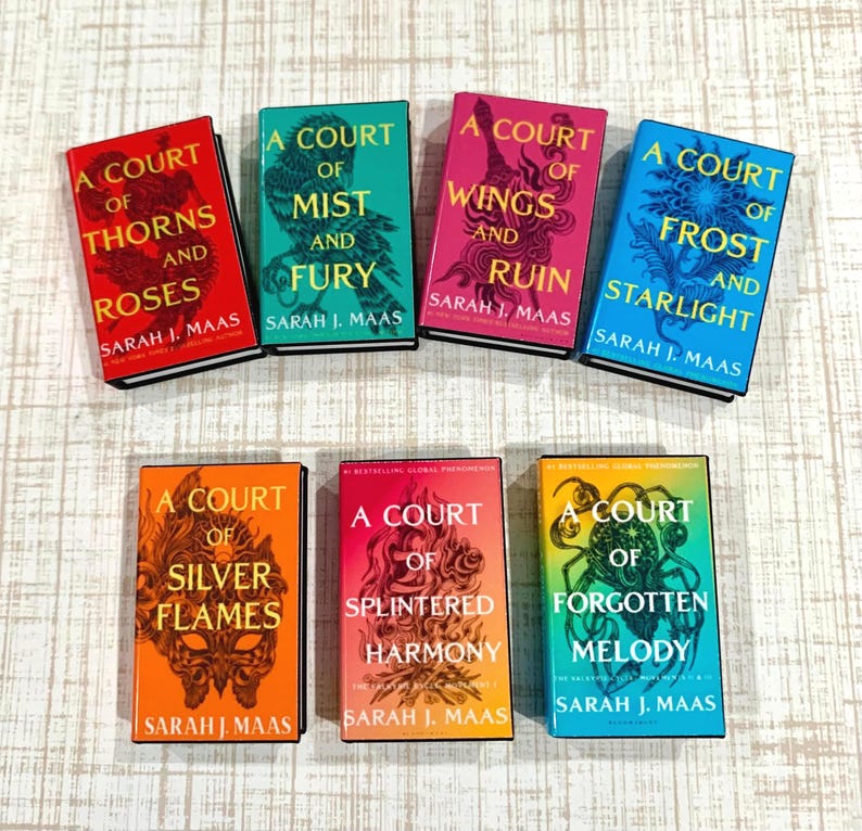May include: A collection of seven books by Sarah J. Maas, including A Court of Thorns and Roses, A Court of Mist and Fury, A Court of Wings and Ruin, A Court of Frost and Starlight, A Court of Silver Flames, A Court of Splintered Harmony, and A Court of Forgotten Melody.